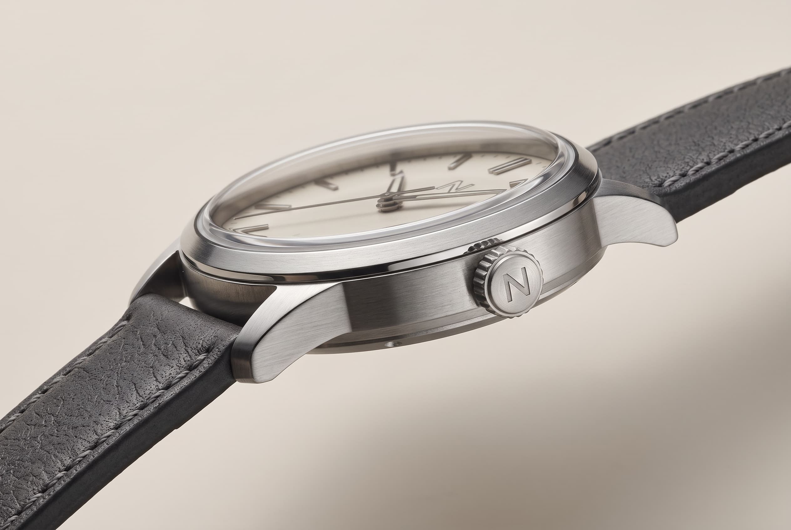 Low side profile of the Atria case, domed sapphire crystal, crown, and lugs