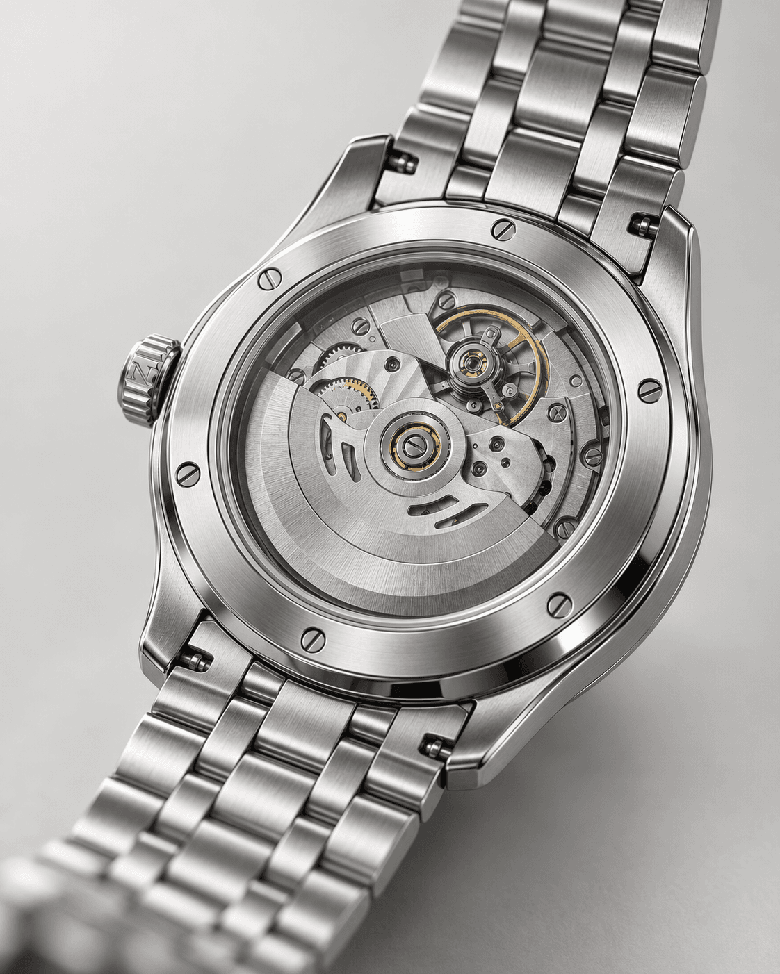Meridian GMT exhibition caseback showing its automatic movement and steel bracelet